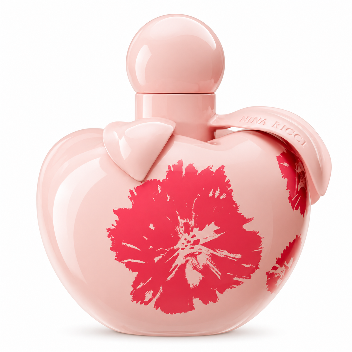 Nina Ricci perfume for women in a glossy pastel pink, apple-shaped bottle with a round pink cap, delicate leaf-shaped details, embossed Nina Ricci lettering and vibrant pink floral prints, photographed against a pure white background.