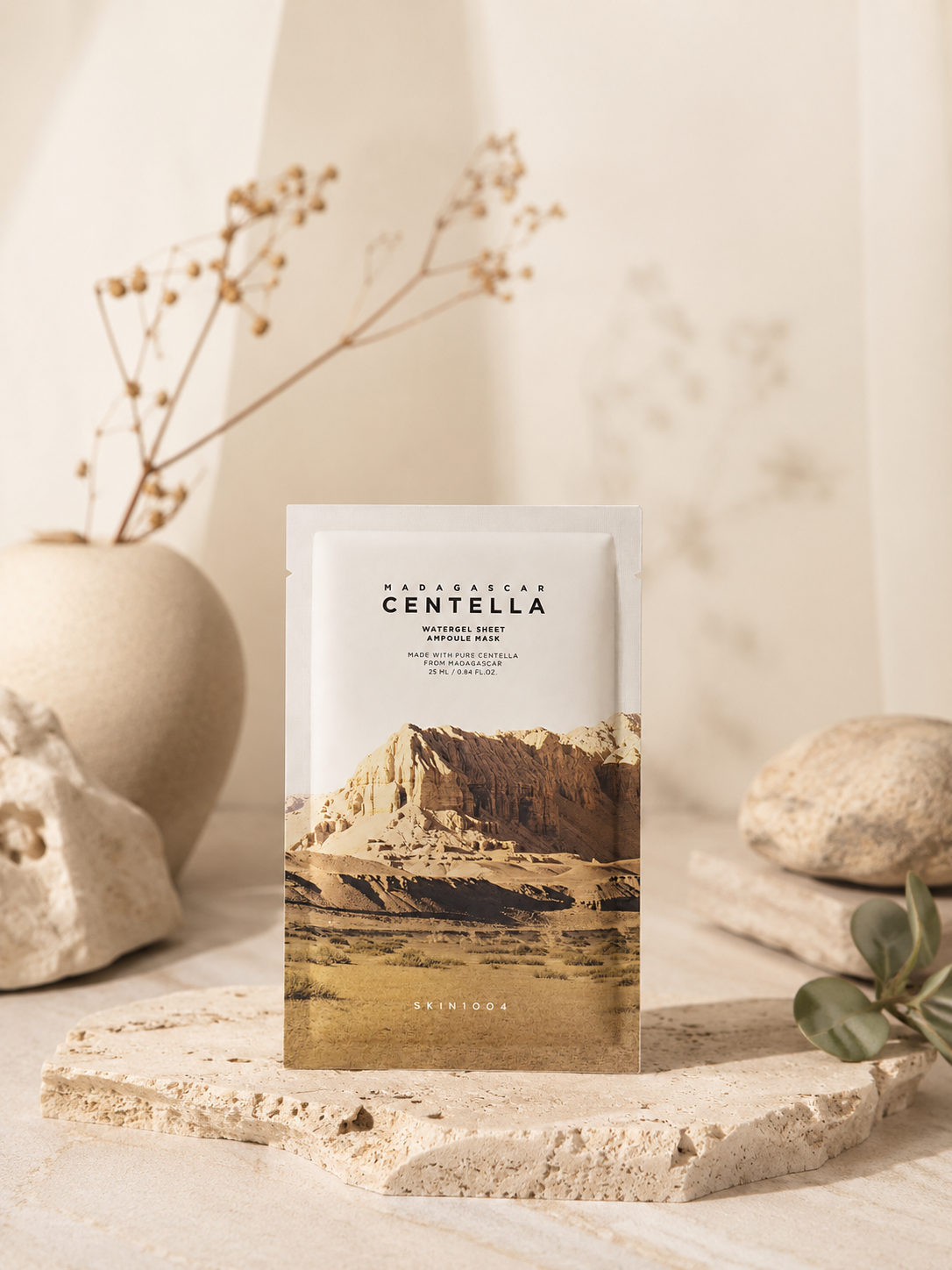 SKIN1004 Madagascar Centella Watergel Sheet Ampoule Mask 25ml on a stone surface with decorative elements