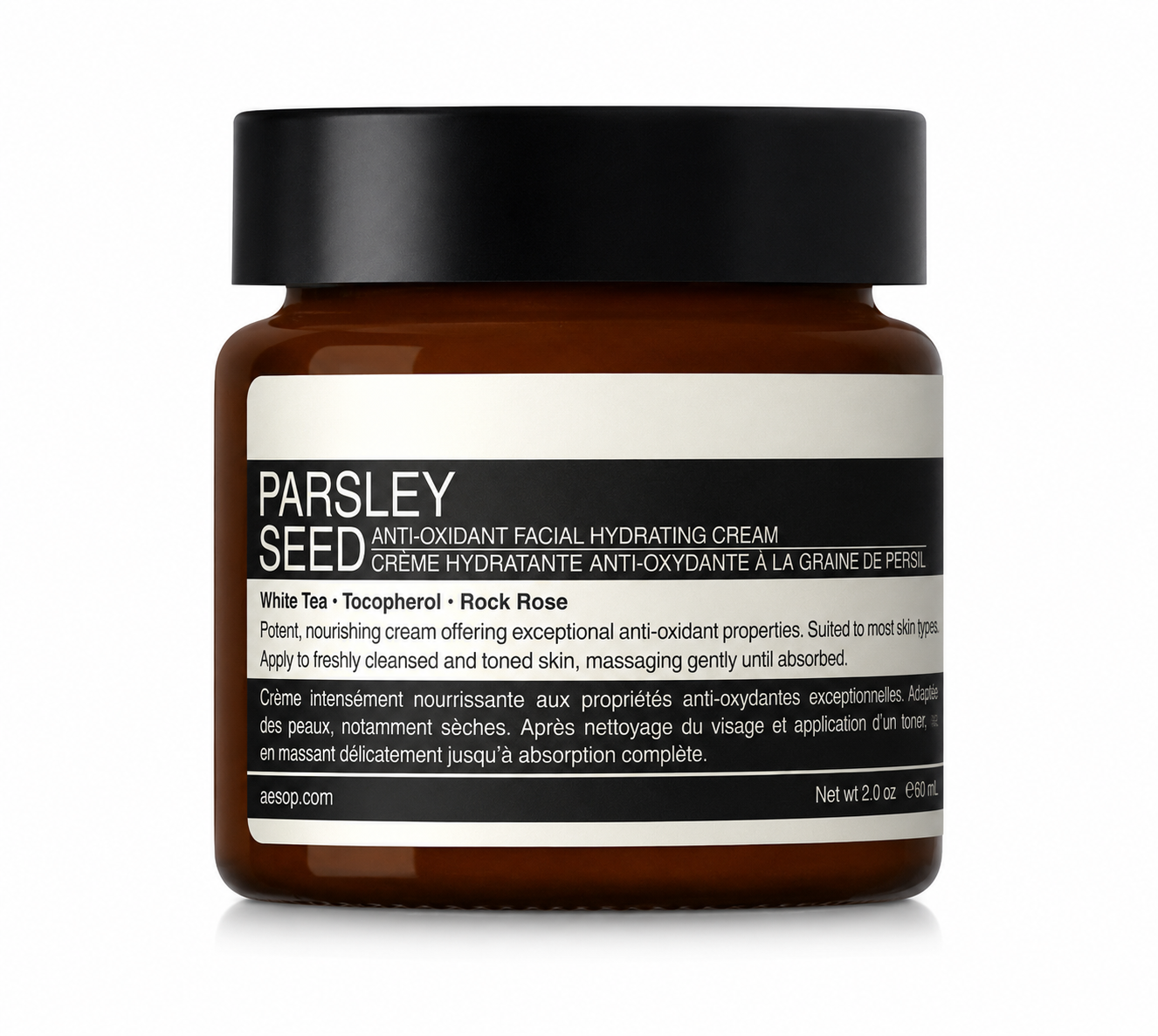 Aesop Parsley Seed Anti-Oxidant Facial Hydrating Cream in an amber glass jar with a black lid and bold black-and-white label, isolated on a white background. This antioxidant-rich facial moisturizer is formulated with white tea, tocopherol (vitamin E), and rock rose to nourish, hydrate, and help defend skin against environmental stressors while showcasing Aesop's iconic apothecary-inspired packaging.