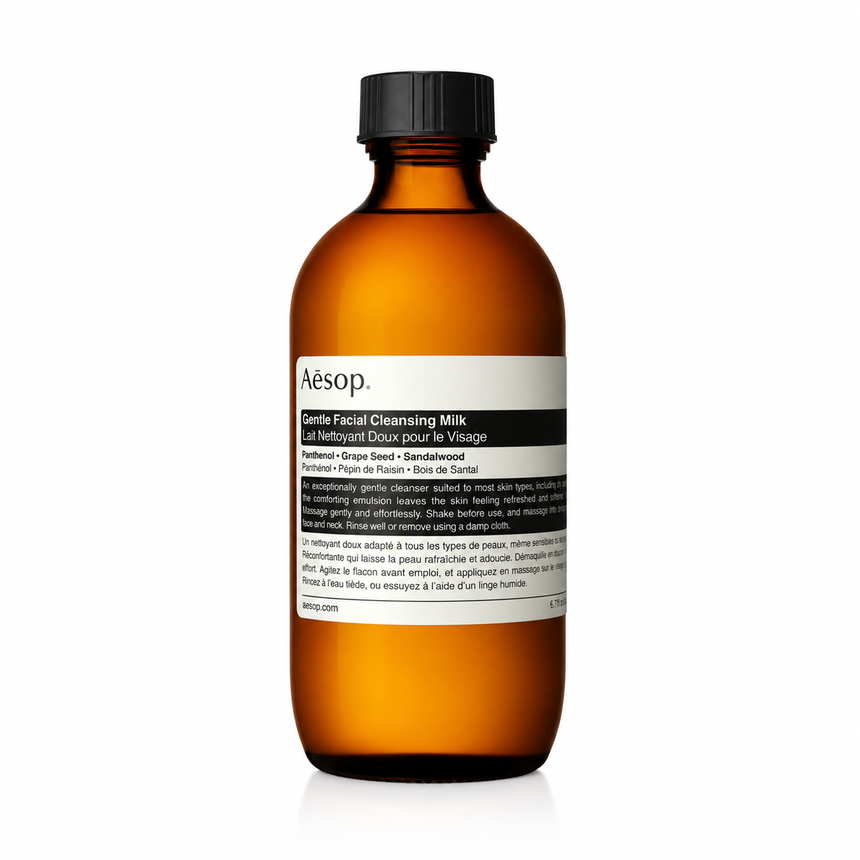 Aesop Gentle Facial Cleansing Milk in a signature amber glass bottle with a black screw cap and Aesop's minimalist white label, isolated on a white background. This gentle cream cleanser is formulated to remove impurities while maintaining the skin's natural moisture balance, making it ideal for normal, dry, and sensitive skin types.