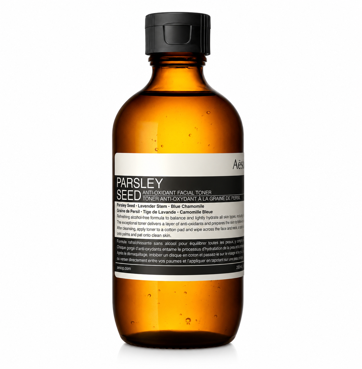 Aesop Parsley Seed Anti-Oxidant Facial Toner in an amber plastic bottle with a black flip-top cap and Aesop's signature minimalist label, isolated on a white background. This alcohol-free facial toner is formulated with parsley seed, lavender stem, and blue chamomile to hydrate, soothe, balance, and provide antioxidant protection while preparing the skin for the next steps in a daily skincare routine.